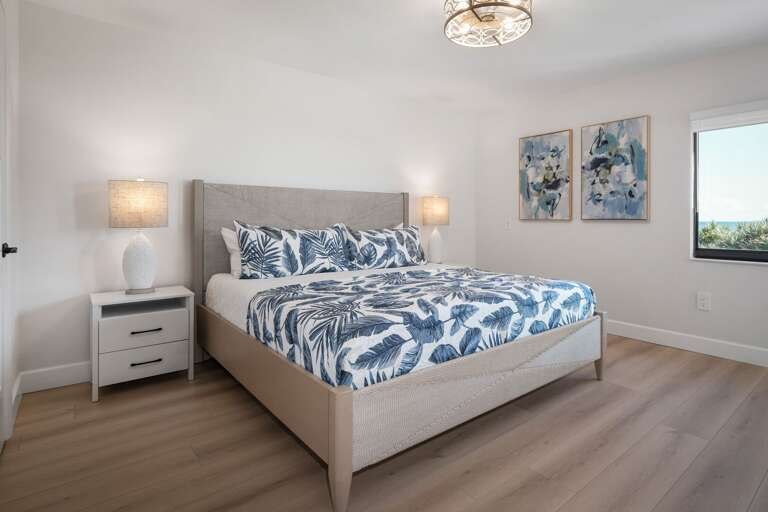 The oceanfront master bedroom features a king bed and an Atlantic Ocean view The oceanfront master bedroom features a king bed and an Atlantic Ocean view