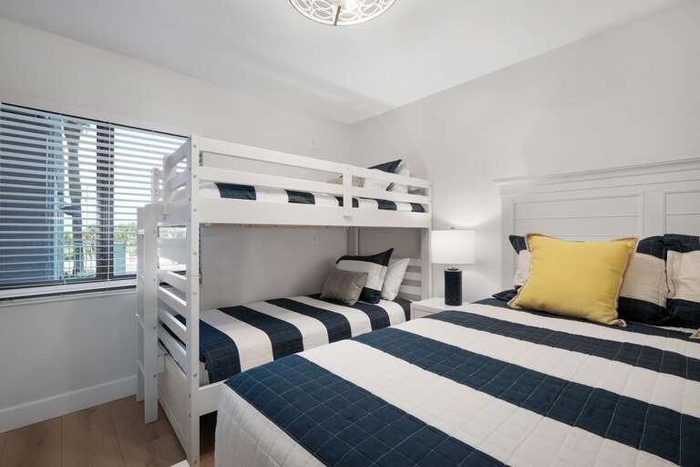 Queen bed and twin bunk bed in the guest bedroom Queen bed and twin bunk bed in the guest bedroom