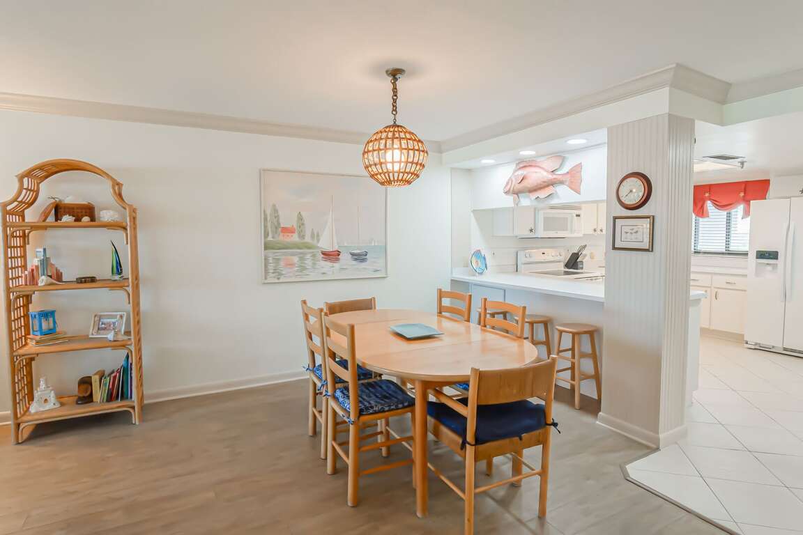 The dining area offers plenty of seating, providing a comfortable space for family meals and gatherings The dining area offers plenty of seating, providing a comfortable space for family meals and gatherings
