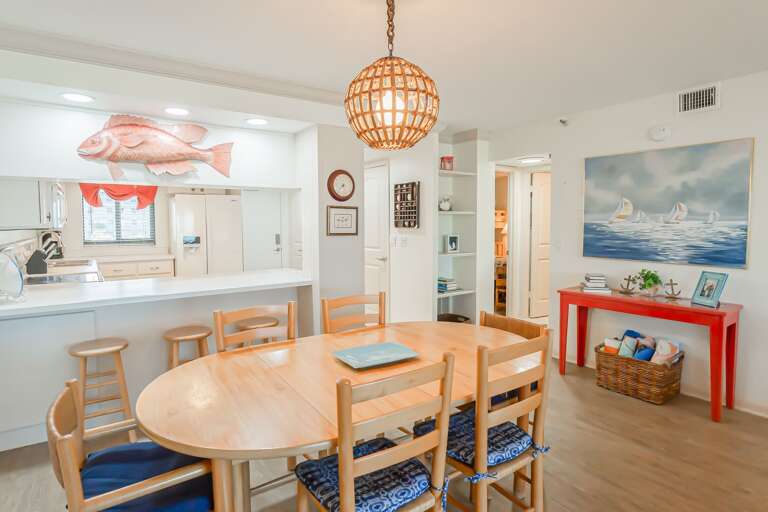 The dining room offers seating for six at the table, plus additional seating with barstools The dining room offers seating for six at the table, plus additional seating with barstools