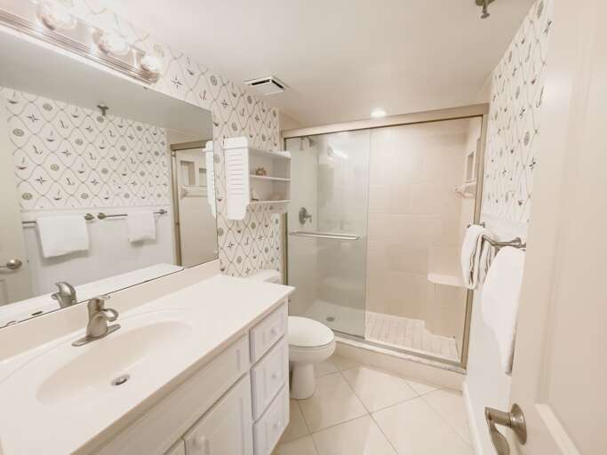 The master bathroom features a glass and tile shower, offering a comfortable and refreshing experience The master bathroom features a glass and tile shower, offering a comfortable and refreshing experience