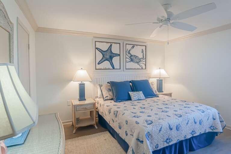 The master bedroom features a comfortable king bed, ensuring a restful night's sleep with ocean views The master bedroom features a comfortable king bed, ensuring a restful night's sleep with ocean views