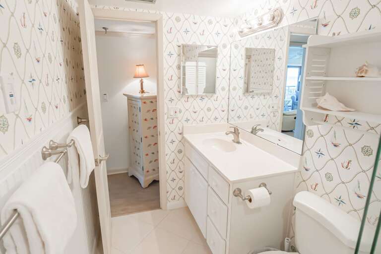 The nautical-themed master ensuite bathroom offers a refreshing space with coastal-inspired decor The nautical-themed master ensuite bathroom offers a refreshing space with coastal-inspired decor