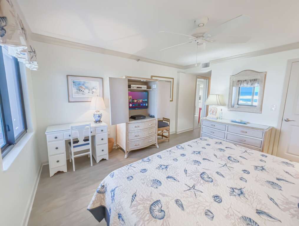 The oceanfront master bedroom includes a TV and a dedicated work area The oceanfront master bedroom includes a TV and a dedicated work area