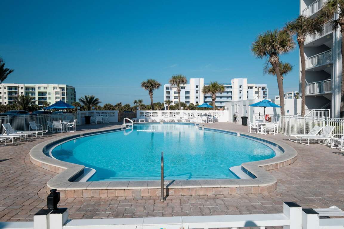 The Shorehom by the Sea pool deck features chairs, tables, a poolside bathroom, and a heated pool The Shorehom by the Sea pool deck features chairs, tables, a poolside bathroom, and a heated pool