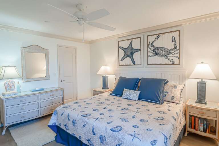 The spacious master bedroom features a comfortable king bed, ensuring a restful night's sleep with ocean views The spacious master bedroom features a comfortable king bed, ensuring a restful night's sleep with ocean views