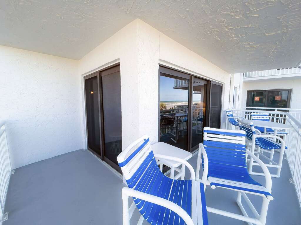 The wrap-around balcony features chairs and tables, offering a perfect spot to relax and take in the views The wrap-around balcony features chairs and tables, offering a perfect spot to relax and take in the views