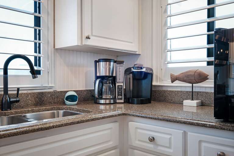 Keurig and standard drip coffee makers are provided in the kitchen
