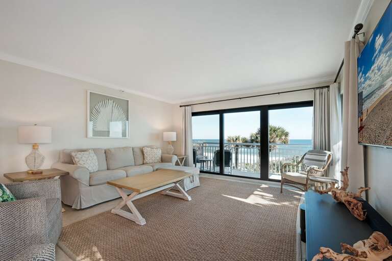 The oceanfront living room provides an incredible view of no-drive New Smyrna Beach