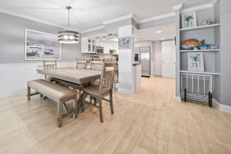 The dining table has an ocean view and seating for 6