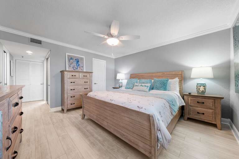 The master bedroom features a king bed and a beach view