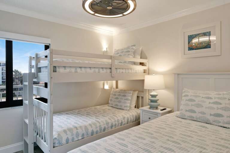 Guest bedroom with a queen bed and a twin bunk bed Guest bedroom with a queen bed and a twin bunk bed