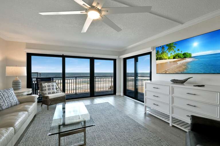 The large TV compliments the stunning New Smyrna Beach view in the oceanfront living room The large TV compliments the stunning New Smyrna Beach view in the oceanfront living room