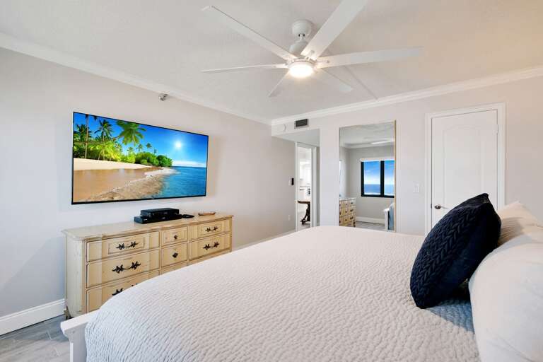 Mounted TV and comfy king bed in the master bedroom Mounted TV and comfy king bed in the master bedroom