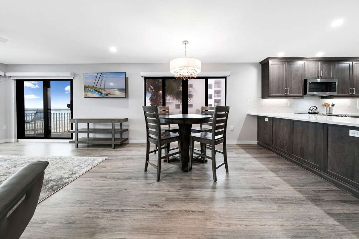 The dining room features a high top table and a stunning view. 2 barstools have been added for extra seating The dining room features a high top table and a stunning view. 2 barstools have been added for extra seating