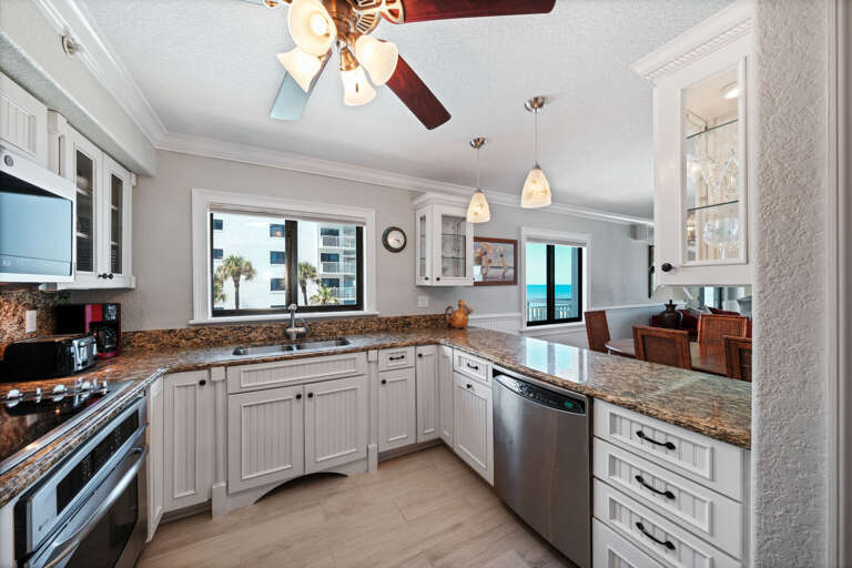 The fully-equipped kitchen also offers views of the Atlantic Ocean and the pool