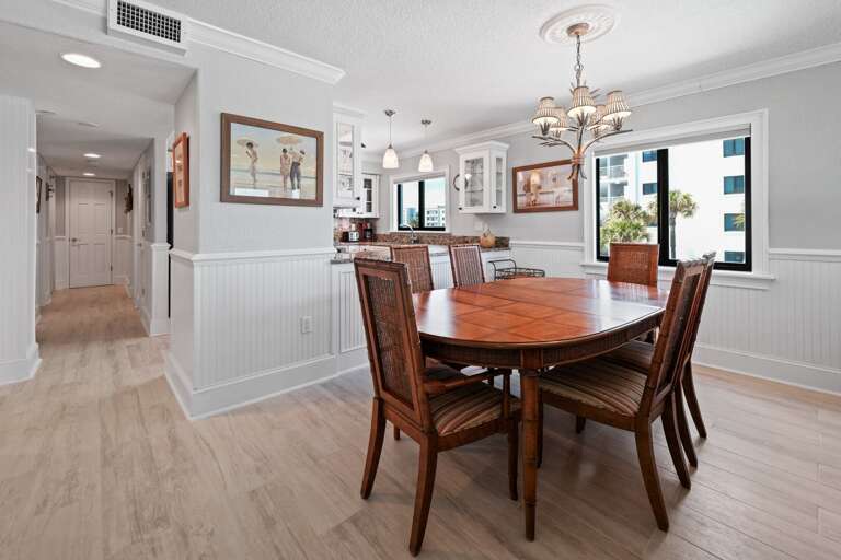 Oceanfront dining room with seating for 6 and a beautiful view of the pool