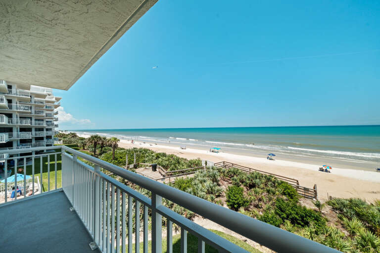 Relax on the spacious, wrap-around corner balcony overlooking no-drive New Smyrna Beach and the inviting Shorehom by the Sea pool
