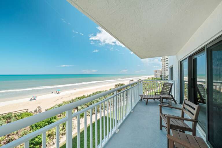 Step outside the living room sliding doors and soak in the beautiful beach and pool view from the wrap-around corner balcony