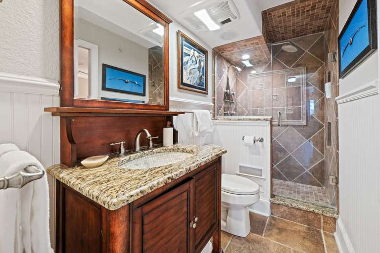 Updated guest bathroom featuring a glass and tile shower for a modern touch