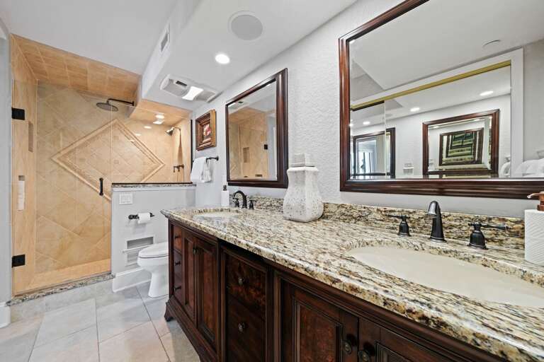Updated master bathroom with a luxurious glass and tile shower