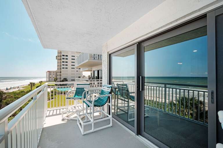Take a seat on the oceanfront balcony furniture to relax after a day at the beach