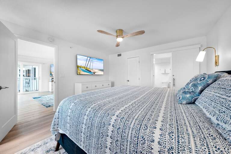 Comfortable king bed and a TV in the master bedroom