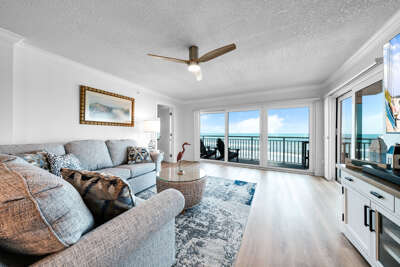 Direct oceanfront living room with a view of no-drive New Smyrna Beach