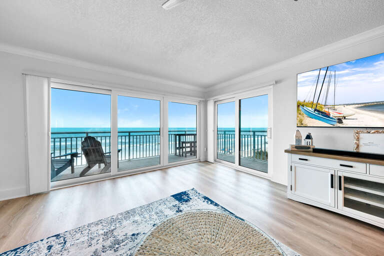 Enjoy the view from the large sliding glass doors in the oceanfront living room