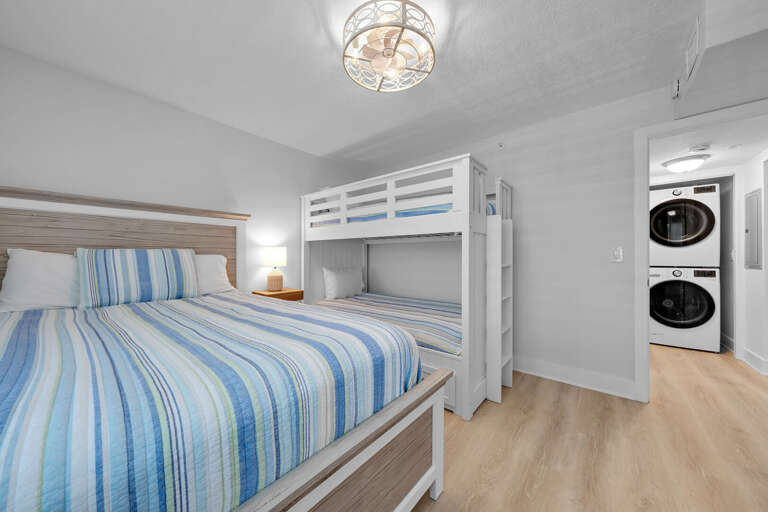 Guest bedroom sleeps 4 guests with a queen bed and a twin bunkbed