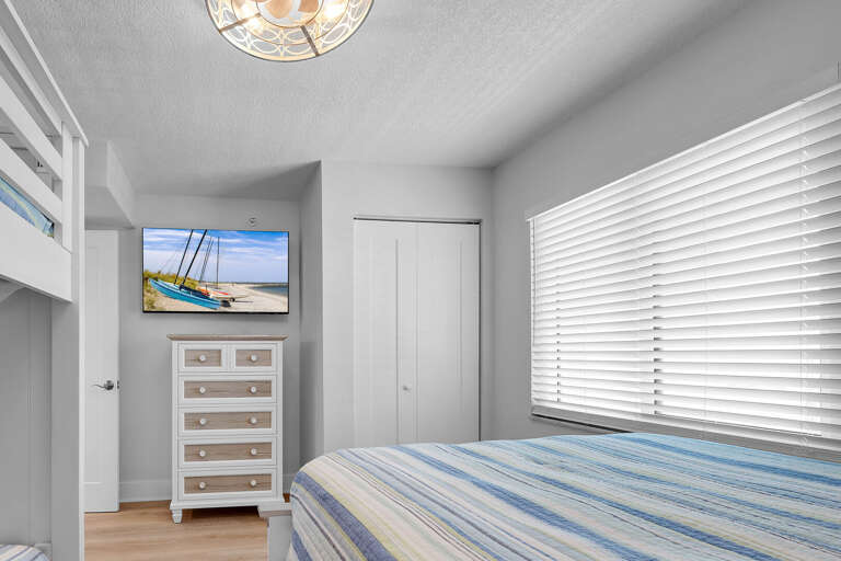 The guest bedroom also has its own TV