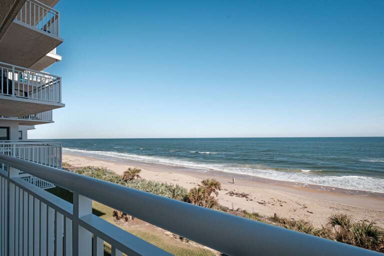 The 4th-floor balcony provides a perfect view of the beach and ocean, making it the ideal spot to enjoy the coastal breeze and sunrise
