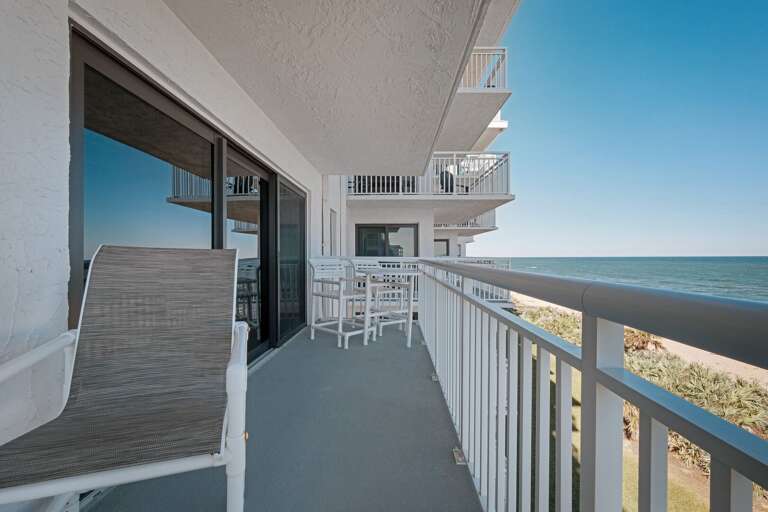 Take advantage of the comfortable seating on the balcony, perfect for breathing in the fresh coastal air while soaking in the stunning views