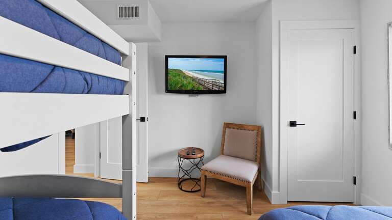 Each bedroom, including the guest bedroom, is equipped with its own TV