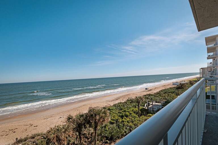 Take in breathtaking views from the 4th-floor private balcony, overlooking the serene beauty of New Smyrna Beach Take in breathtaking views from the 4th-floor private balcony, overlooking the serene beauty of New Smyrna Beach