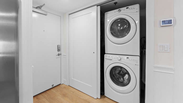 A full-sized washer and dryer conveniently located inside the condo
