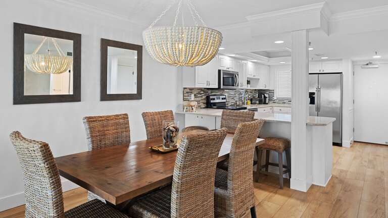 Gather comfortably with seating for 6 at the dining room table, plus bonus barstool seating at the kitchen counter