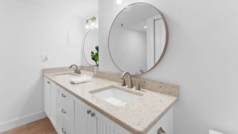 Indulge in the master bathroom featuring a double vanity, providing plenty of space and a modern design