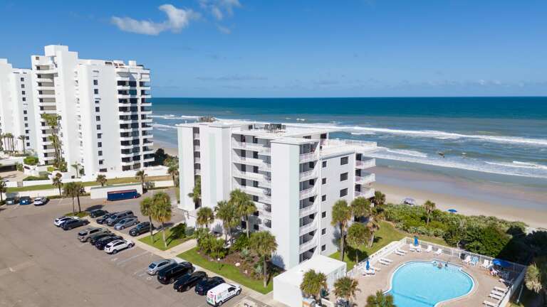 Shorehom by the Sea in New Smyrna Beach offers the perfect coastal retreat with direct oceanfront views and a peaceful, no-drive beach setting