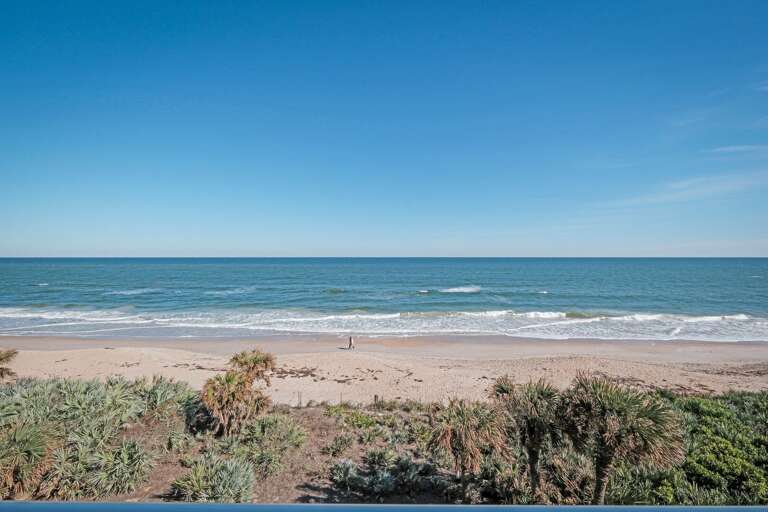 Take in the stunning balcony view, overlooking lush dunes and offering a picturesque glimpse of the Atlantic Ocean