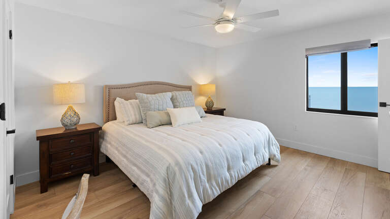 Wake up to a stunning ocean view right from the king bed in the master bedroom, offering the perfect start to your day by the beach