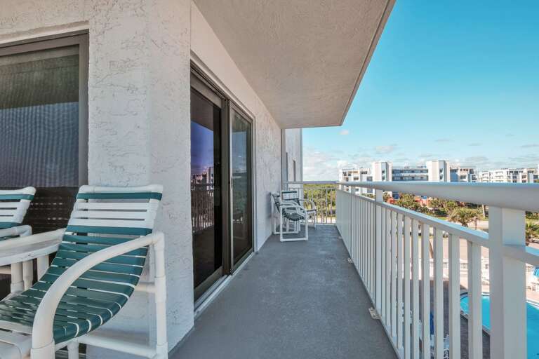 This corner condo wrap-around balcony also provides a view of Shorehom by the Sea's pool