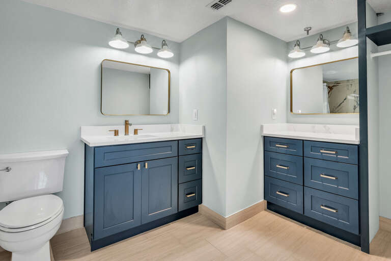 The master bathroom has been fully renovated and features a double vanity