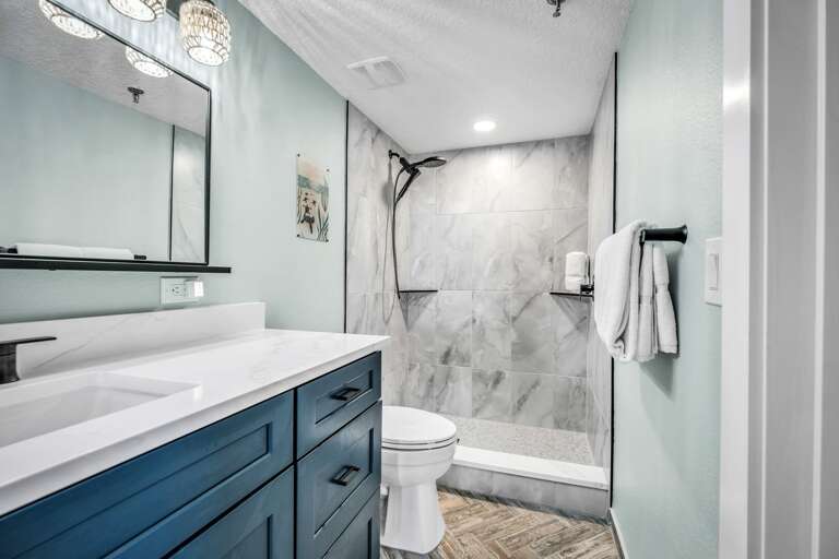 Modern tile shower in the guest bathroom