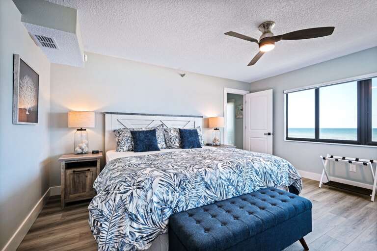 Oceanfront master bedroom with a king bed