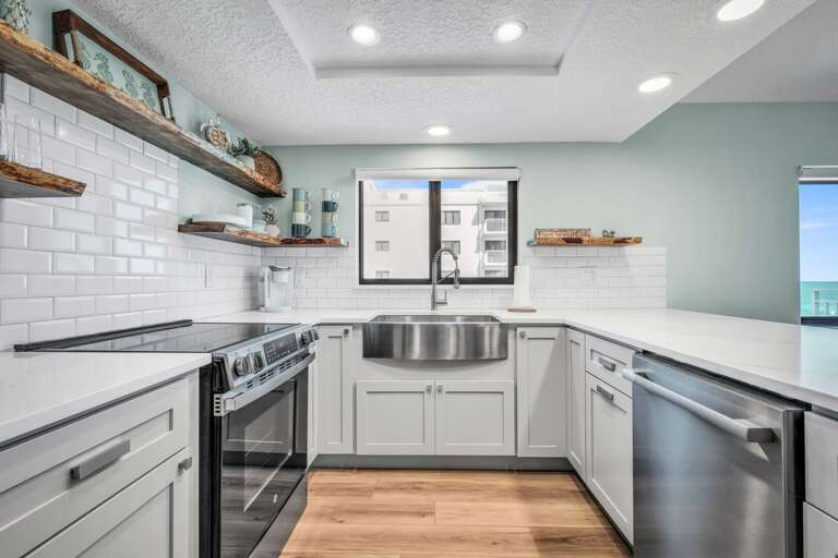 Stylish kitchen with a view of Shorehom by the Sea's pool from the sink window