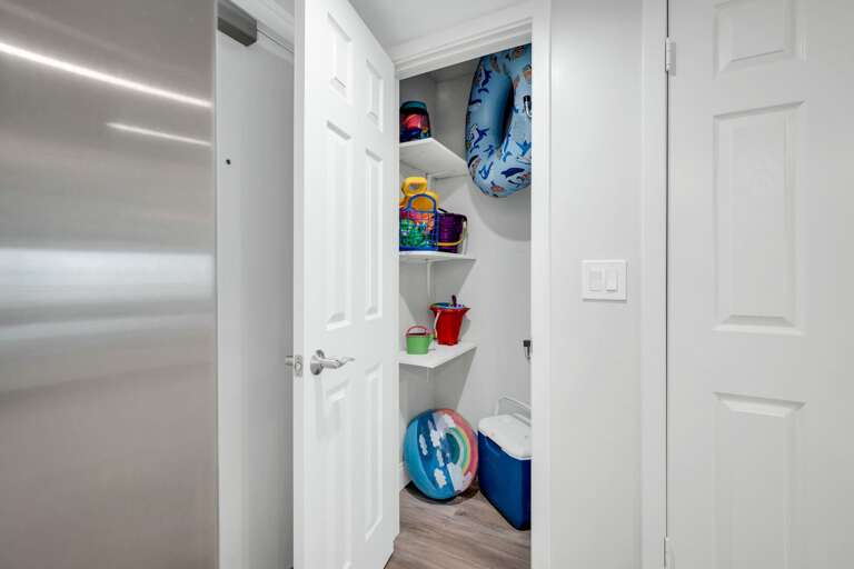 Beach items are provided in the interior closet by the front door