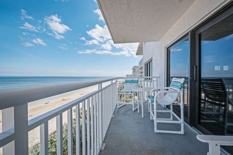 Take in breathtaking views of New Smyrna Beach from the expansive wraparound corner balcony