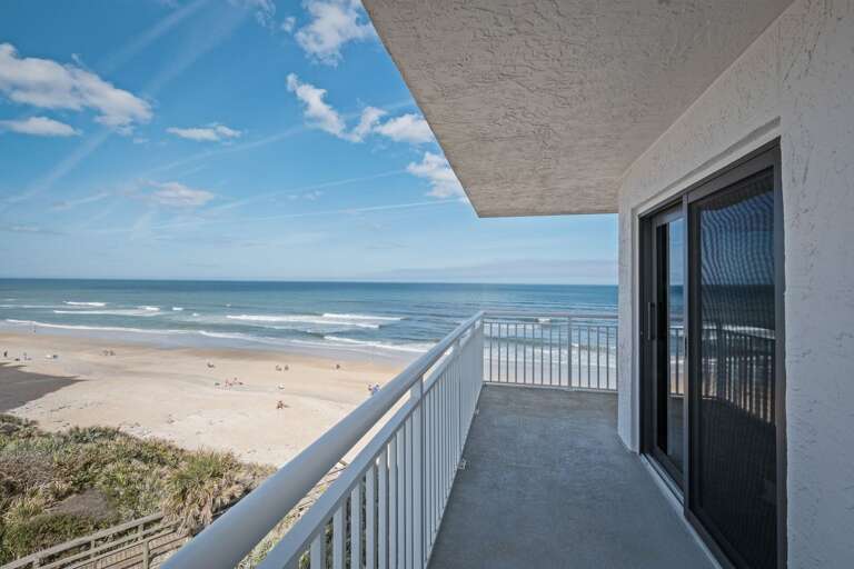 This corner condo, with its wraparound balcony, offers the best panoramic views of New Smyrna Beach for an unforgettable coastal experience