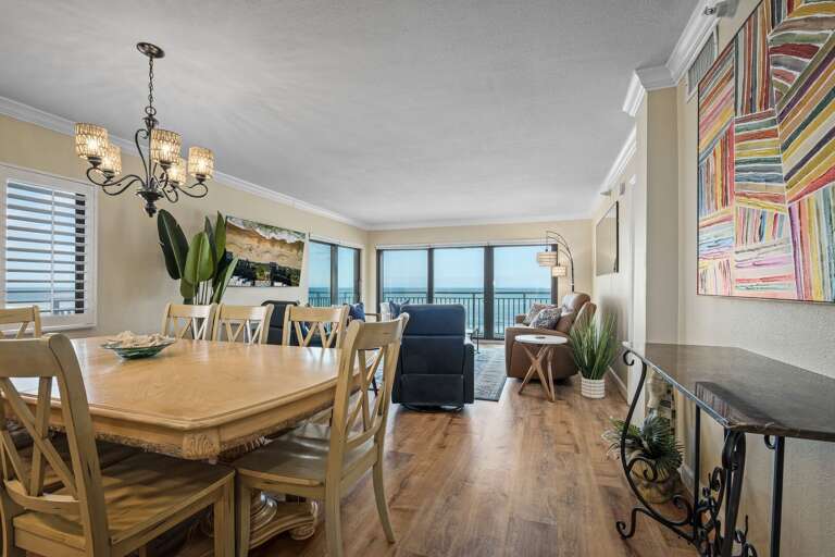 Enjoy breathtaking beach views from the dining room window and expansive sliding glass doors in this oceanfront corner condo